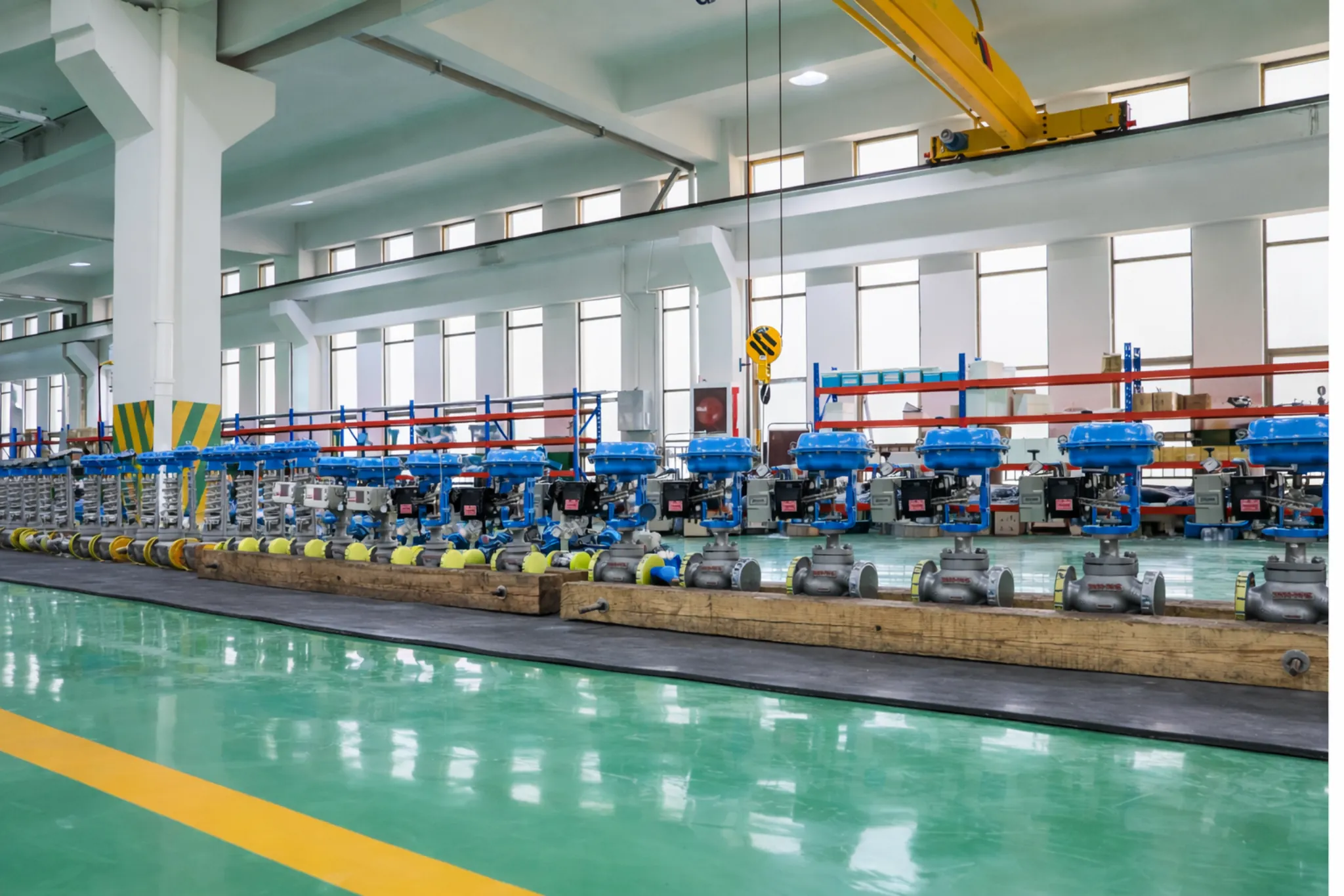 Pneumatic valves and cranes in an industrial workshop