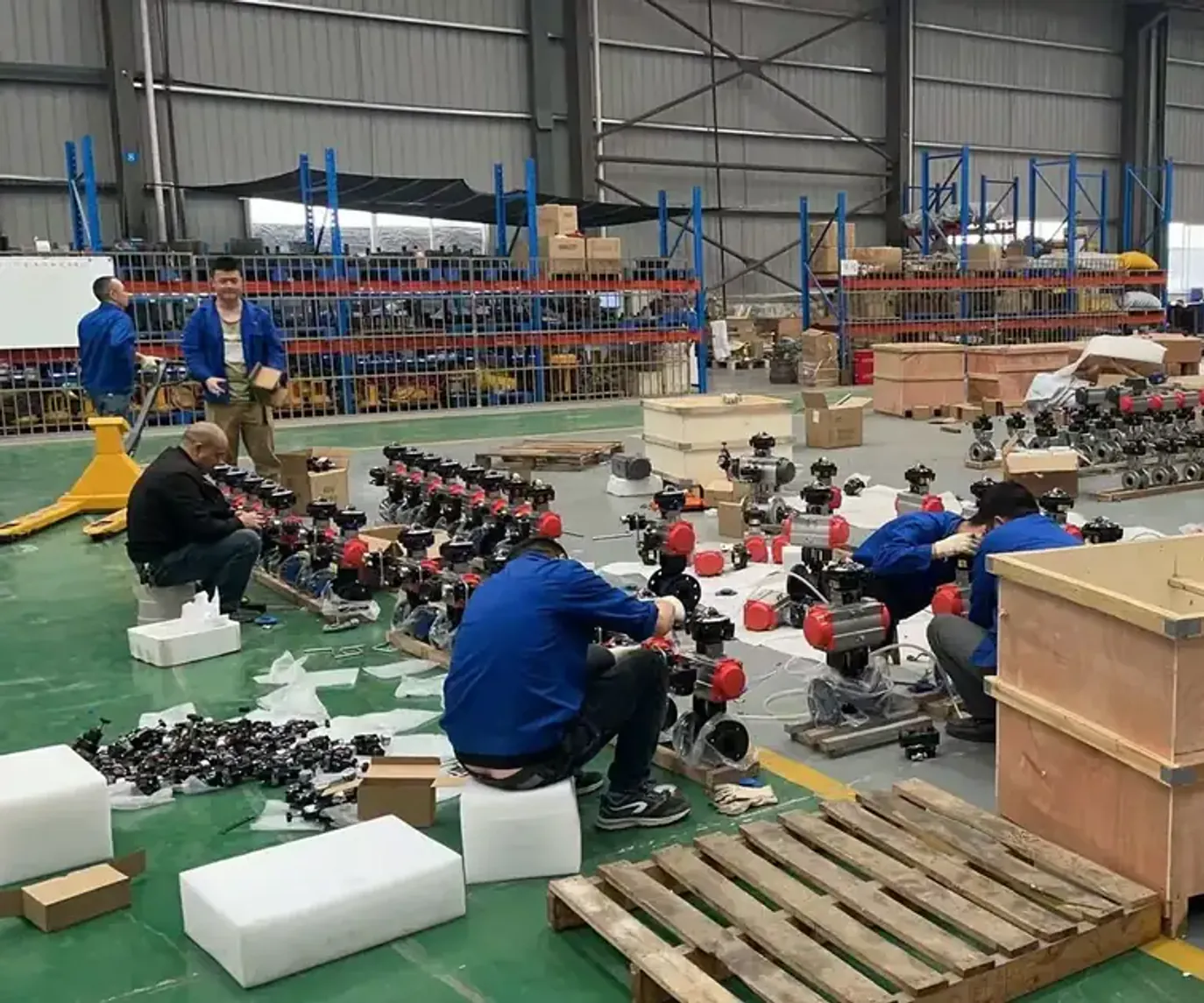 Workers assembling valves in the factory